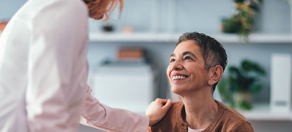 Friendly Interaction Between Doctor and Patient in a Modern Office Setting