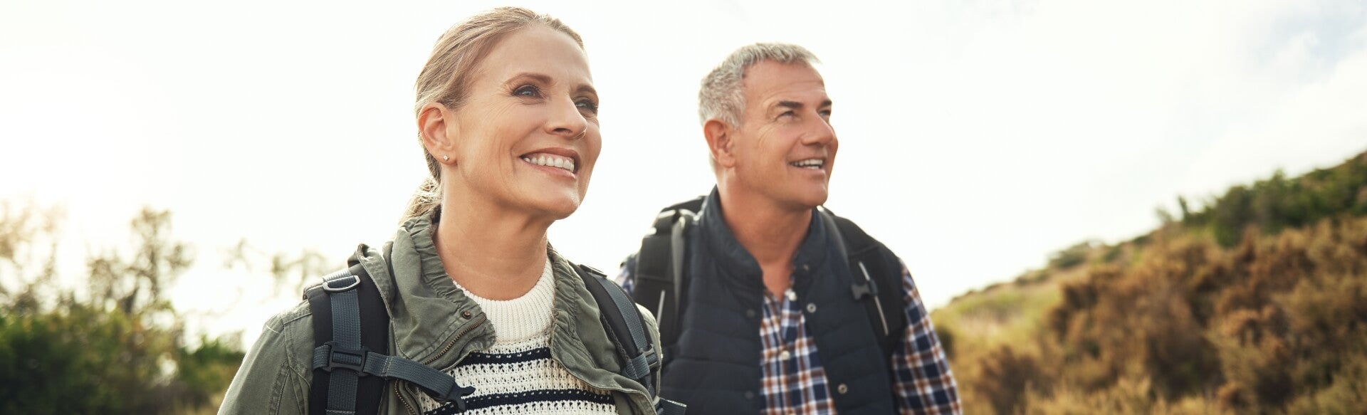 Couple on a hike smiling